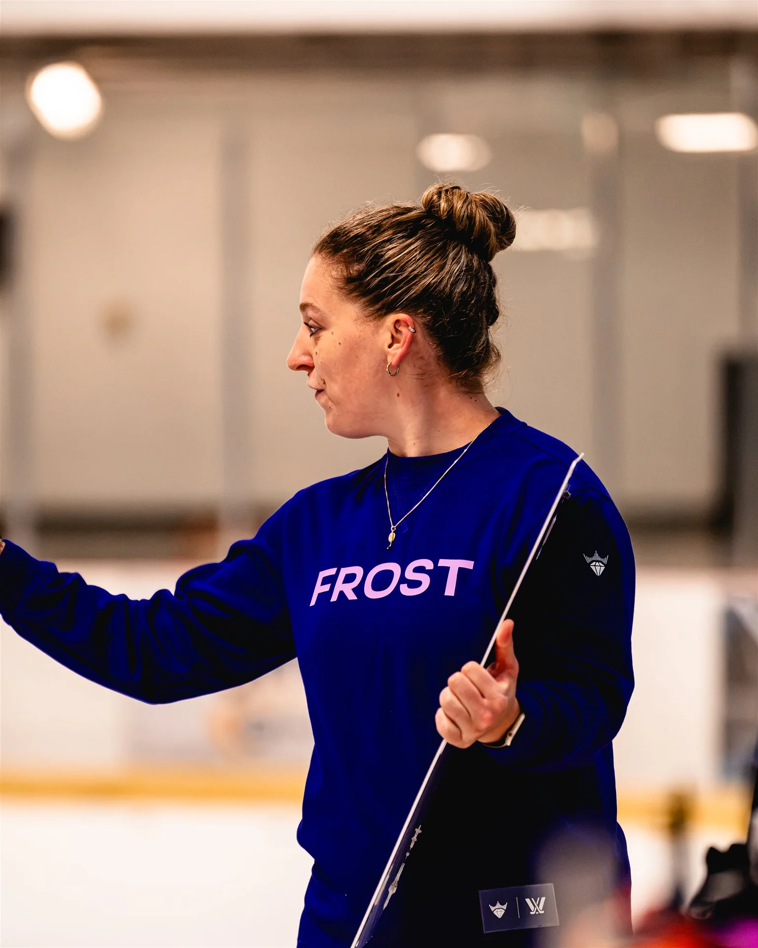 A professional athlete sharing on-ice instruction during Training With the Pros